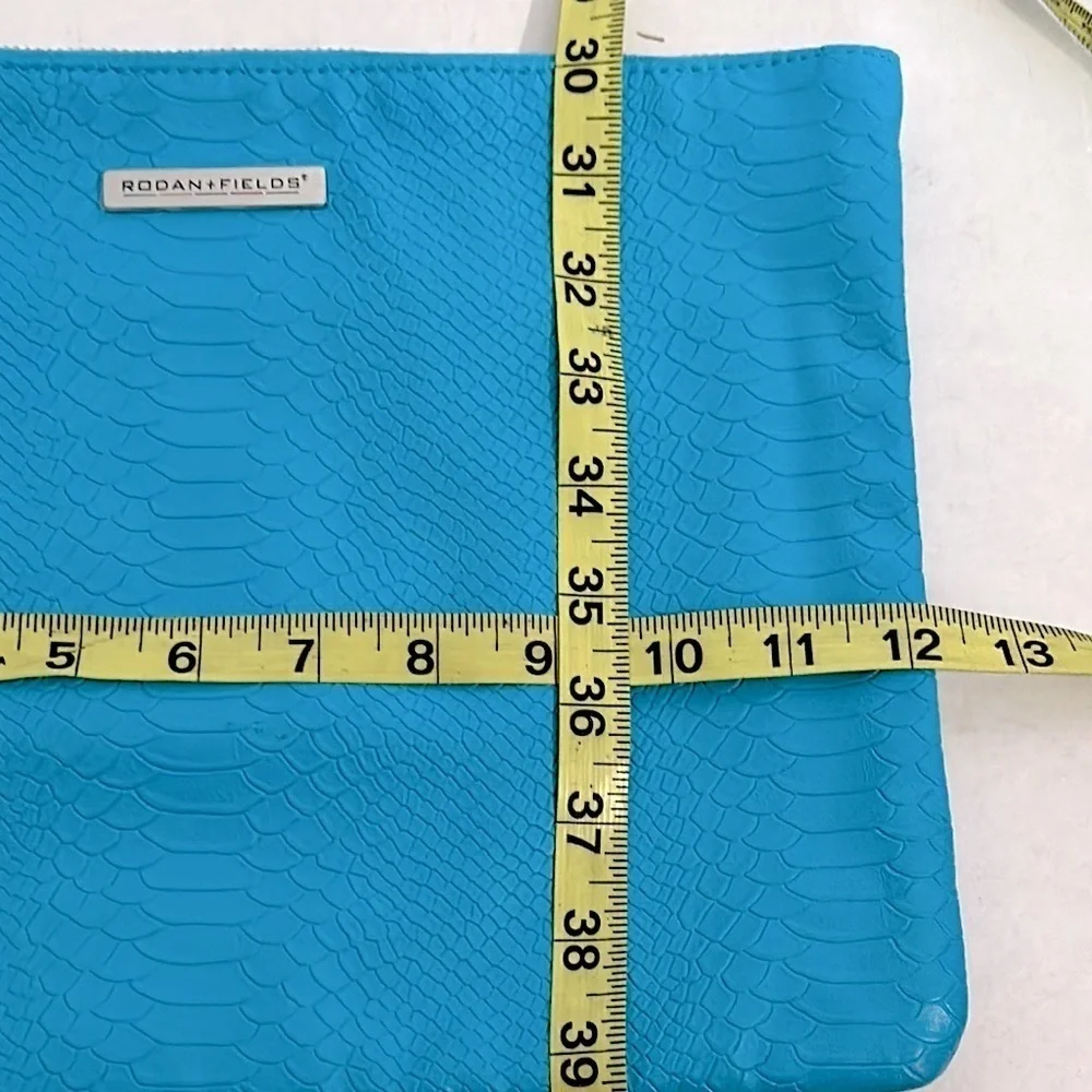 Vibrant Blue Rodan + Fields snake print Cosmetic Bag with Decorative Tassel